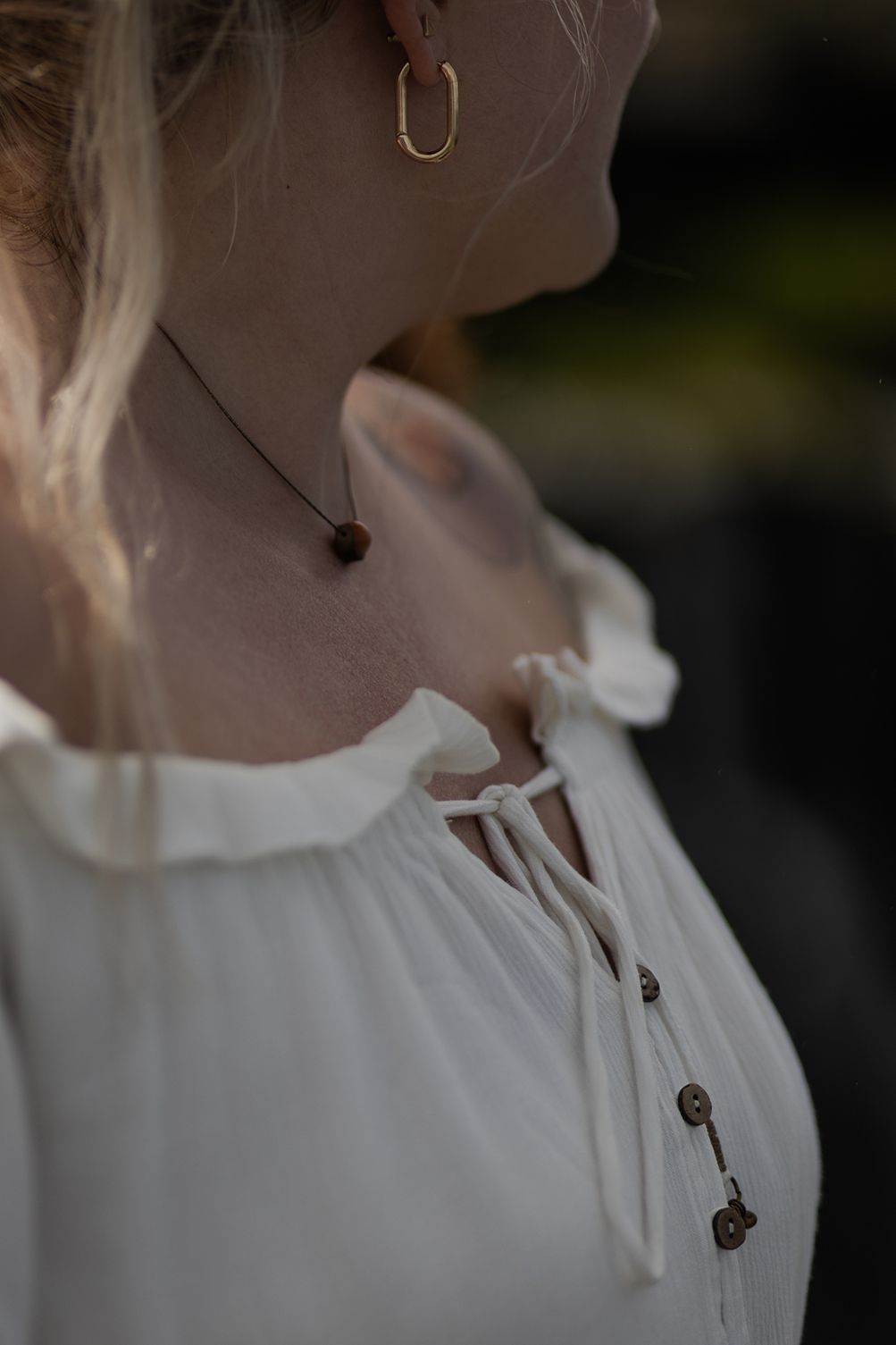 close up details of brides dress at Hags Head Cliffs of Moher elopement