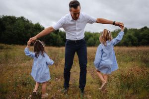 Playful family interactions captured in a series of candid moments in a natural field setting.
