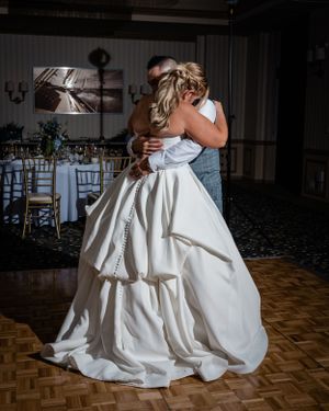 Beautiful couple having a private moment during their first dance at their wedding reception in Redondo Beach, CA