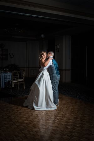 Beautiful couple having a private moment during their first dance at their wedding reception in Redondo Beach, CA