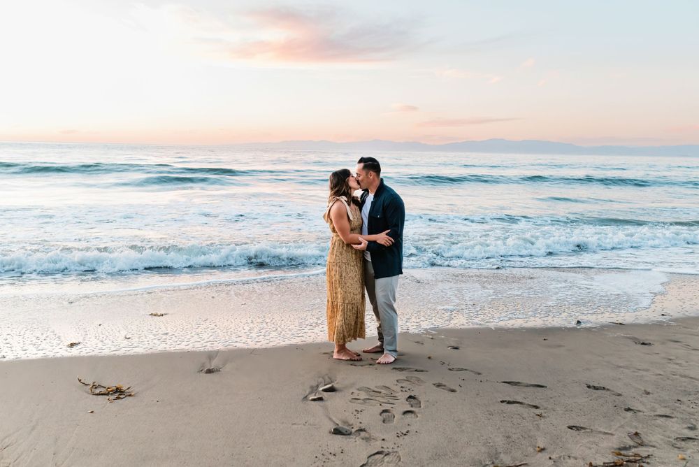 Romantic image of a couple kissing on the beach at sunset in Palos Verdes, California