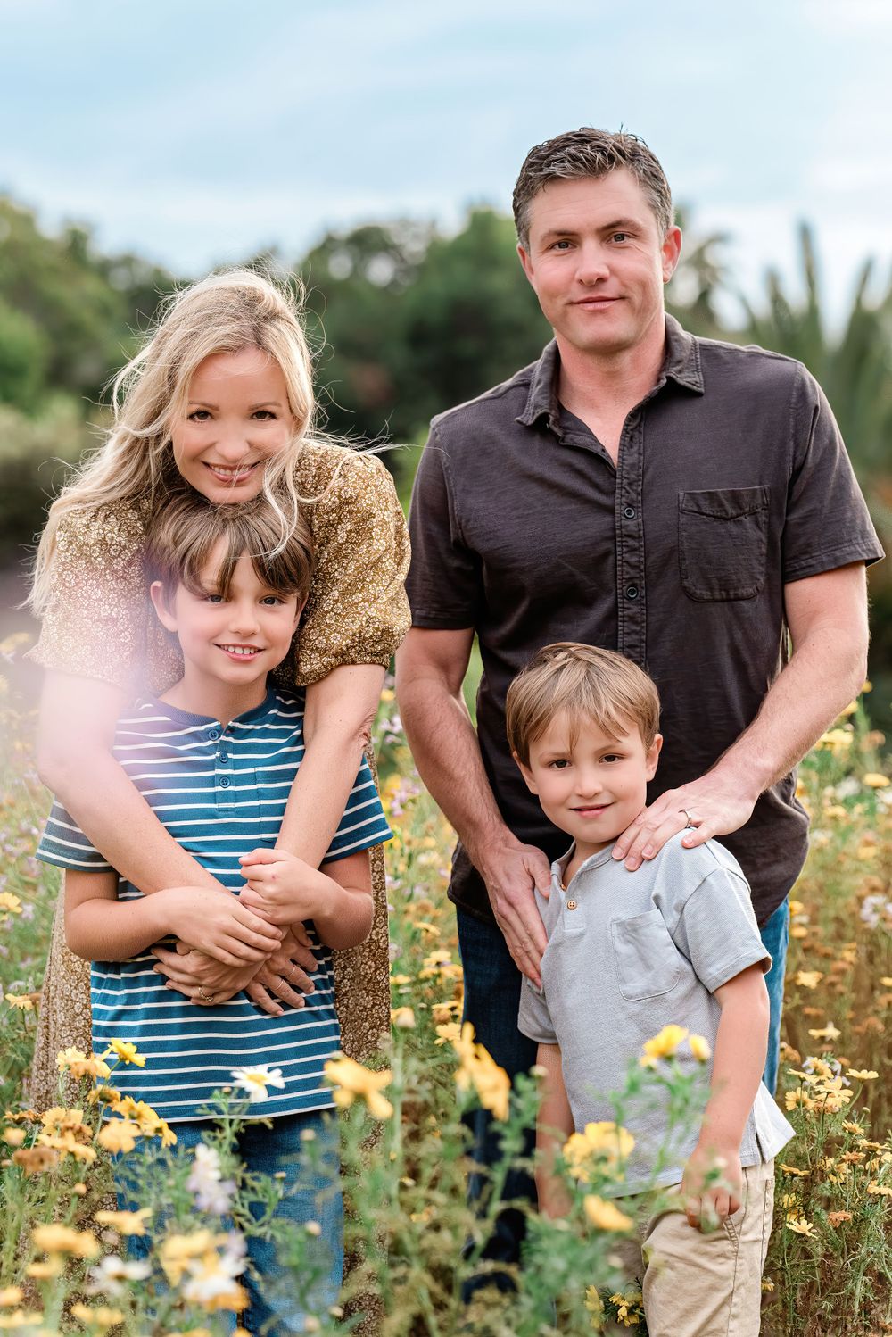 Family standing in yellow wildflowers in Palos Verdes, California