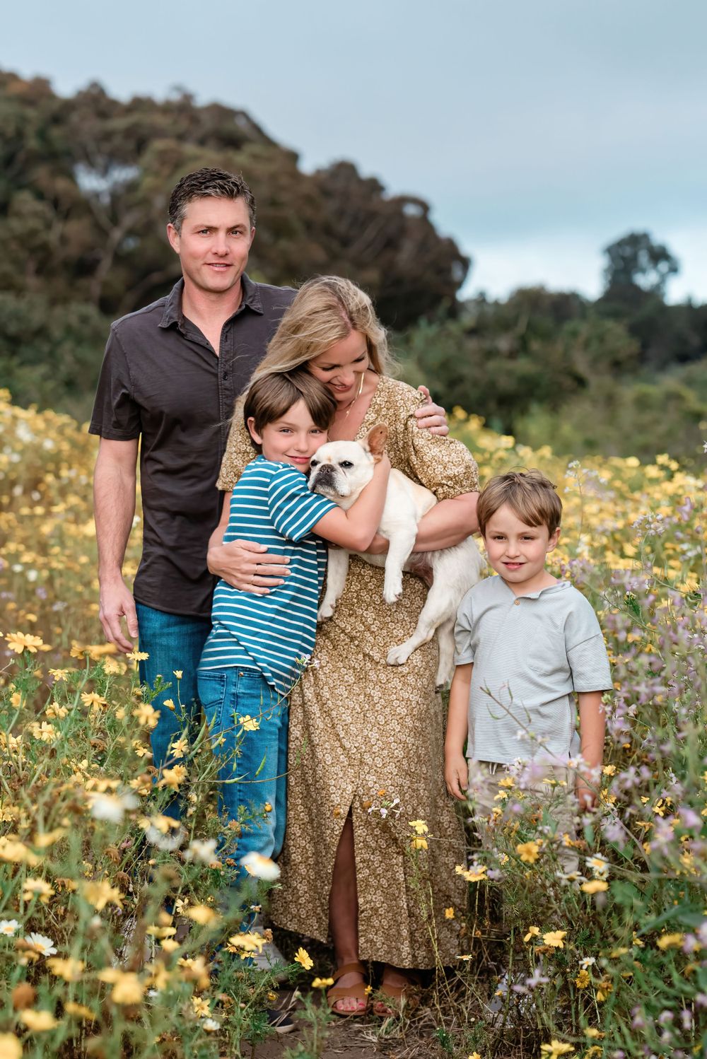 Family standing in yellow wildflowers in Palos Verdes, California