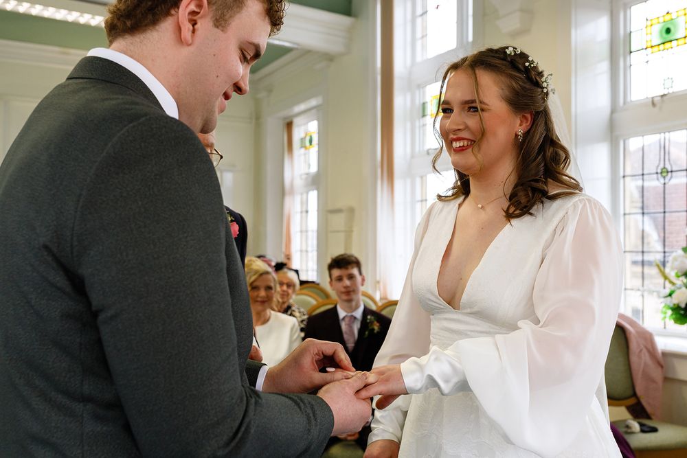 Candid wedding photos of newlyweds sharing a laugh inside the Clitheroe Clock Tower wedding venue