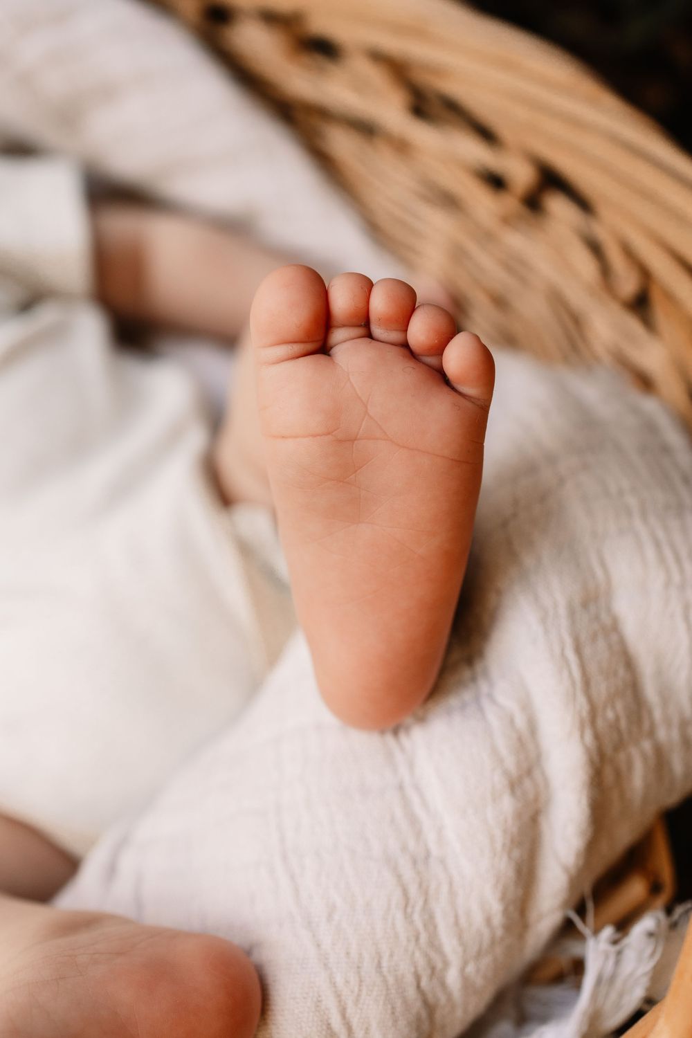 Close-up of a baby's tiny bare foot during a lifestyle family photography session in Oak Ridge, Tennessee.