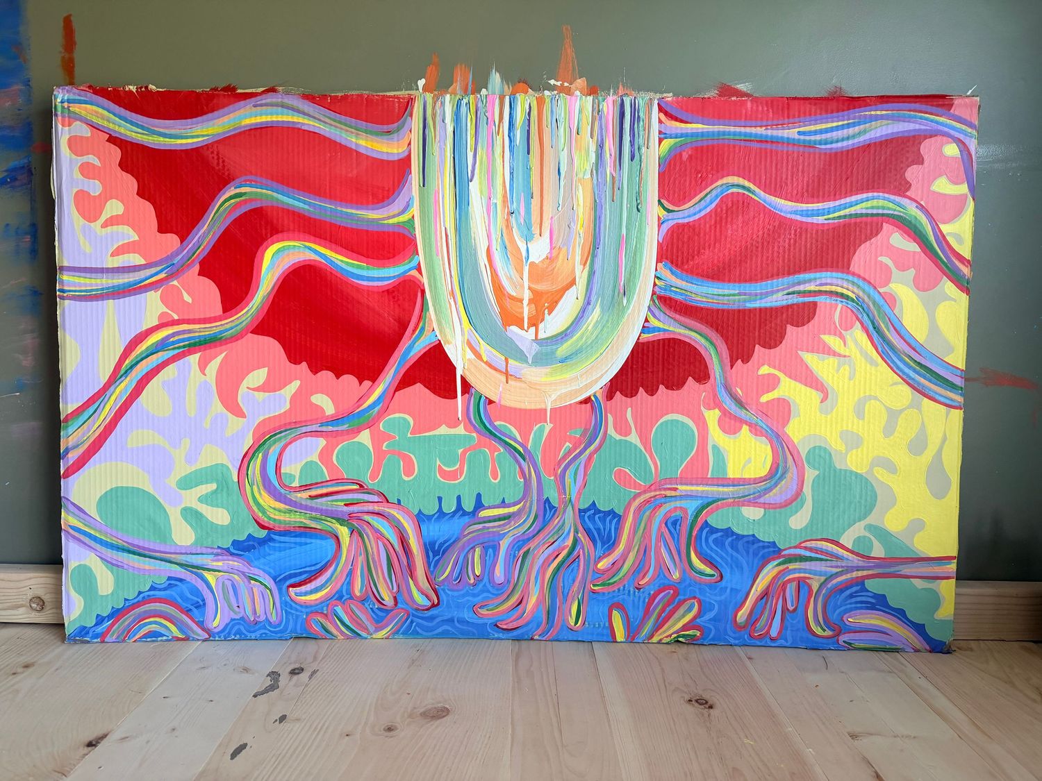 Vibrant psychedelic eye painting on black canvas with yellow, blue, and red abstract patterns in a wooden frame.