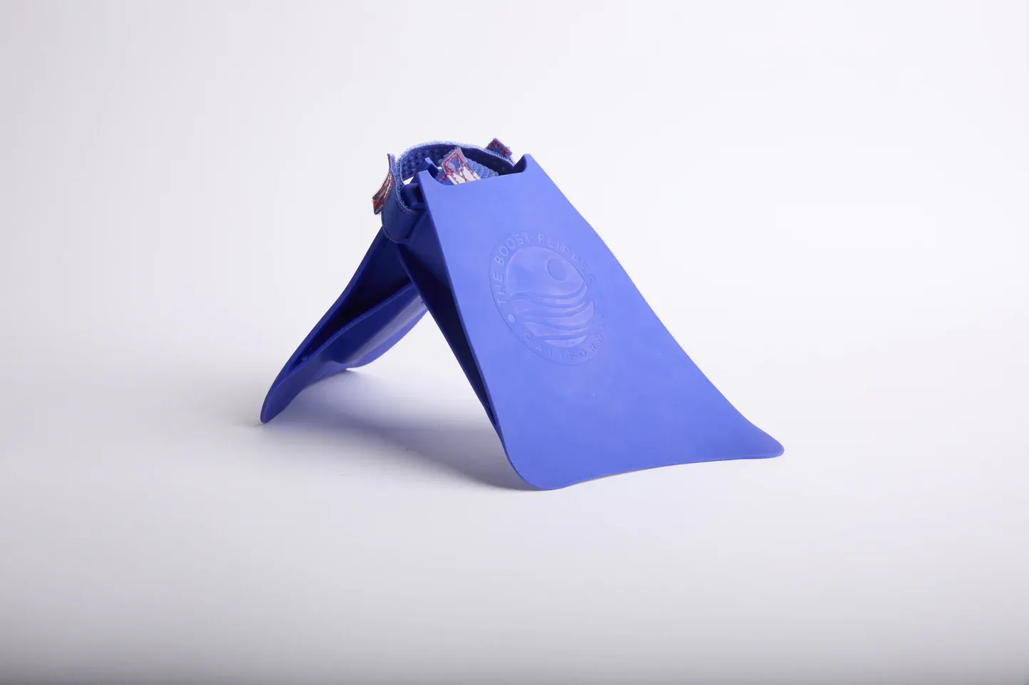 Product photo of blue Boost Flipper California swim fins and bodysurfing flippers on a white background.