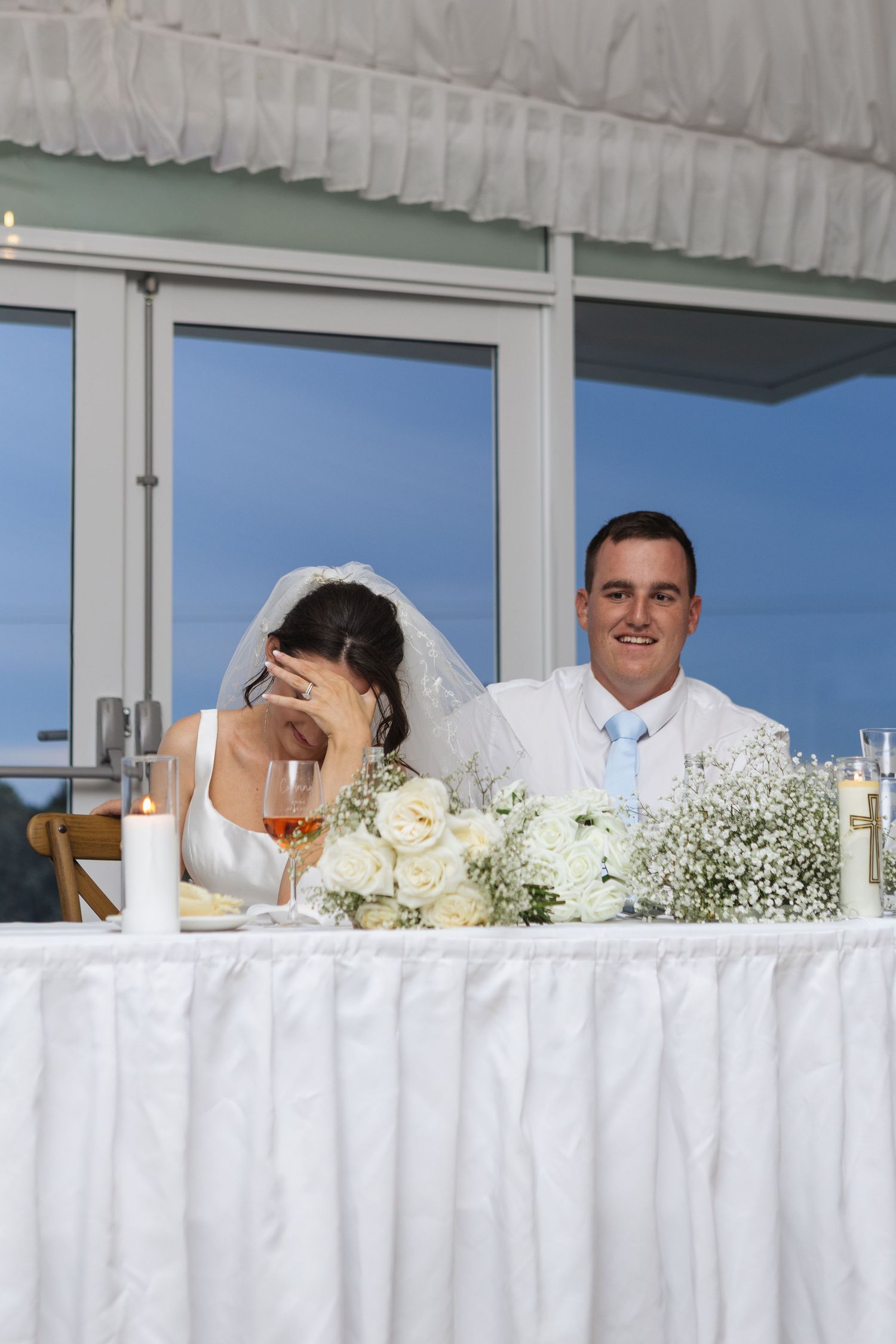 Bride and groom laughing during speeches in marquee at Two Rivers Winery Wedding in Denman