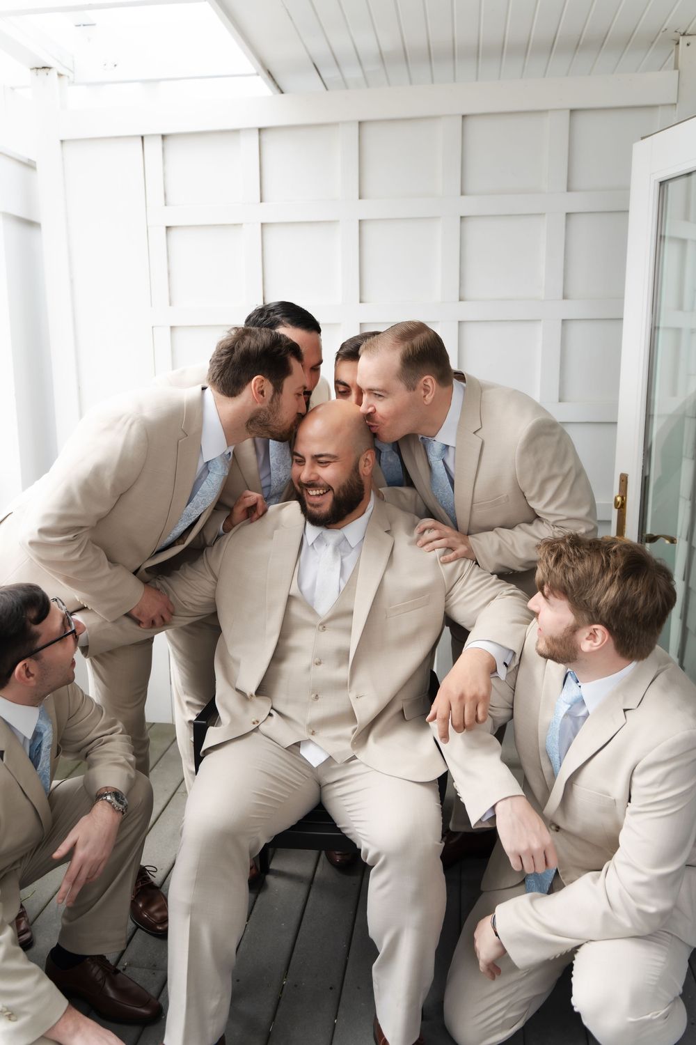 waters edge resort in connecticut groomsmen photos