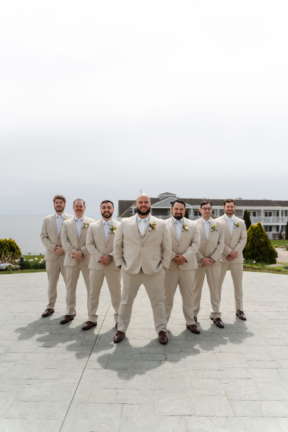 waters edge resort in connecticut groomsmen photos