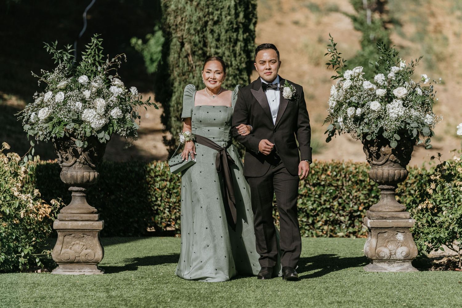 Paul walking down the aisle with his mother at Falkner Winery