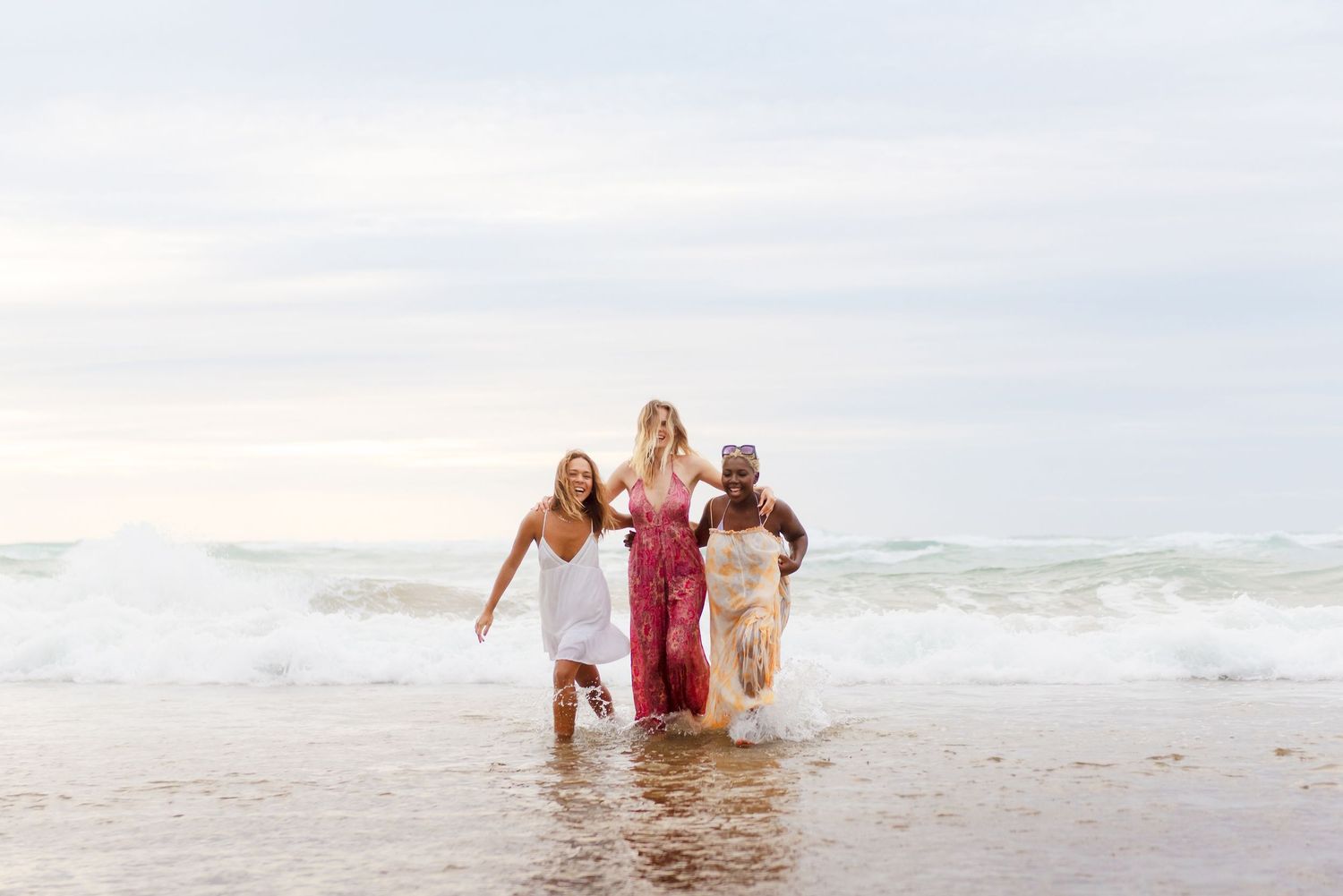Women celebrating life on a beach