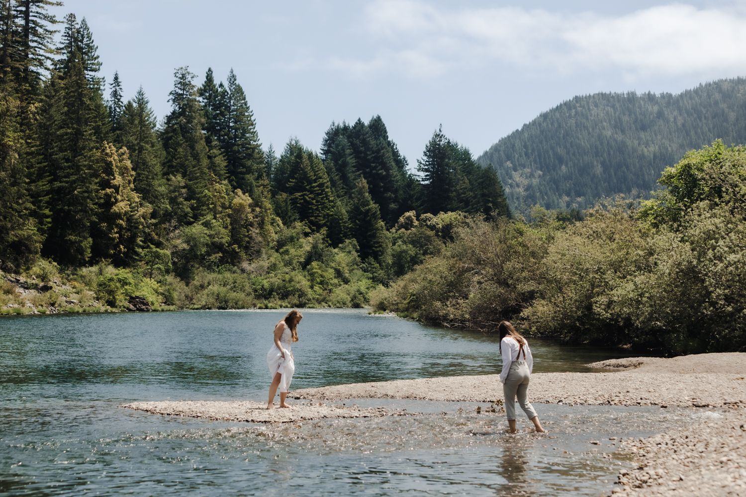 LGBTQ couple walks along the smith river on their elopement day in California and Oregon