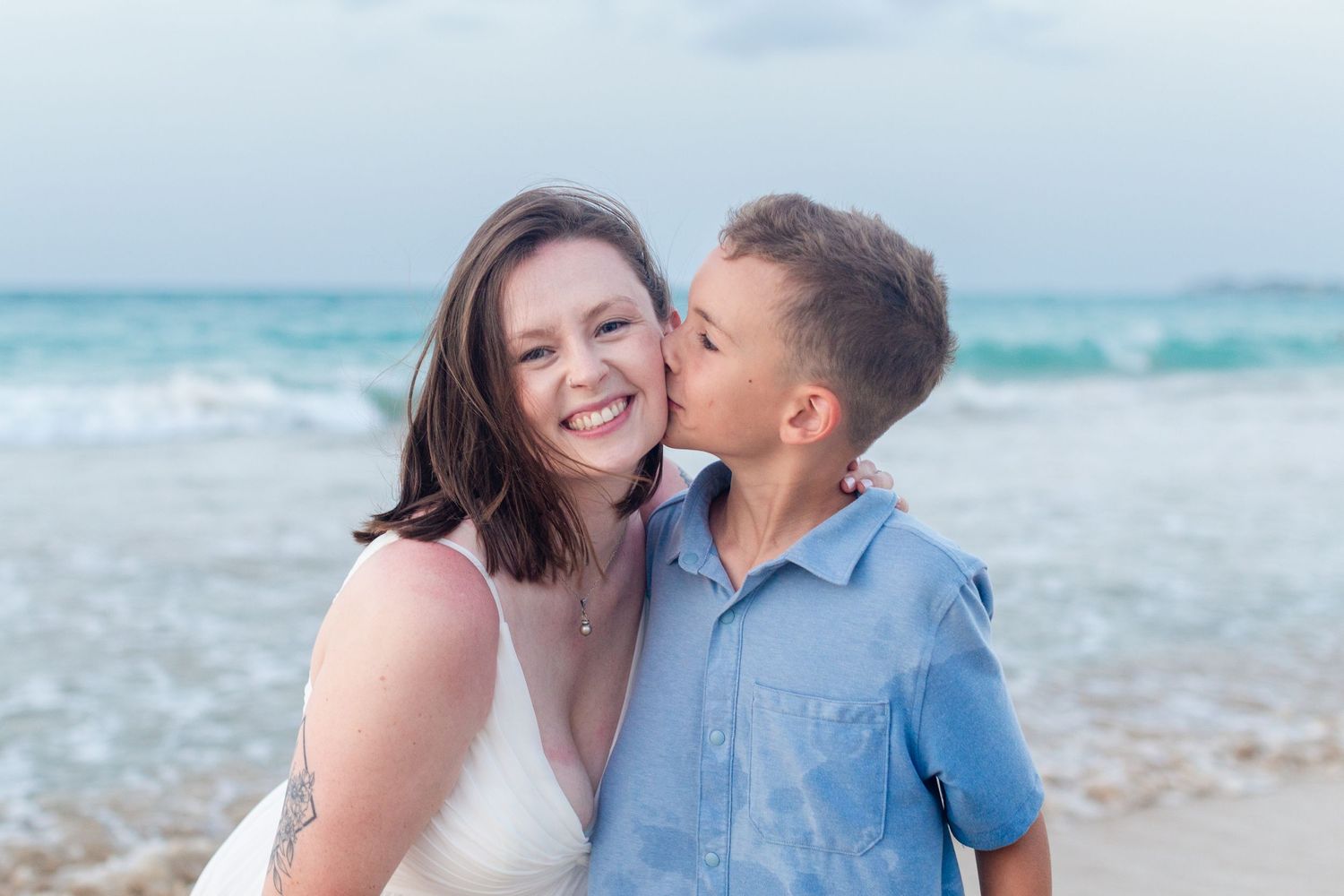 Portrait of a mother and son on the beach in Isla Verde, Carolina, Puerto Rico.