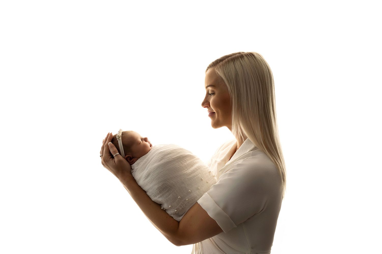 Newborn baby girl during her newborn photoshoot in Exeter