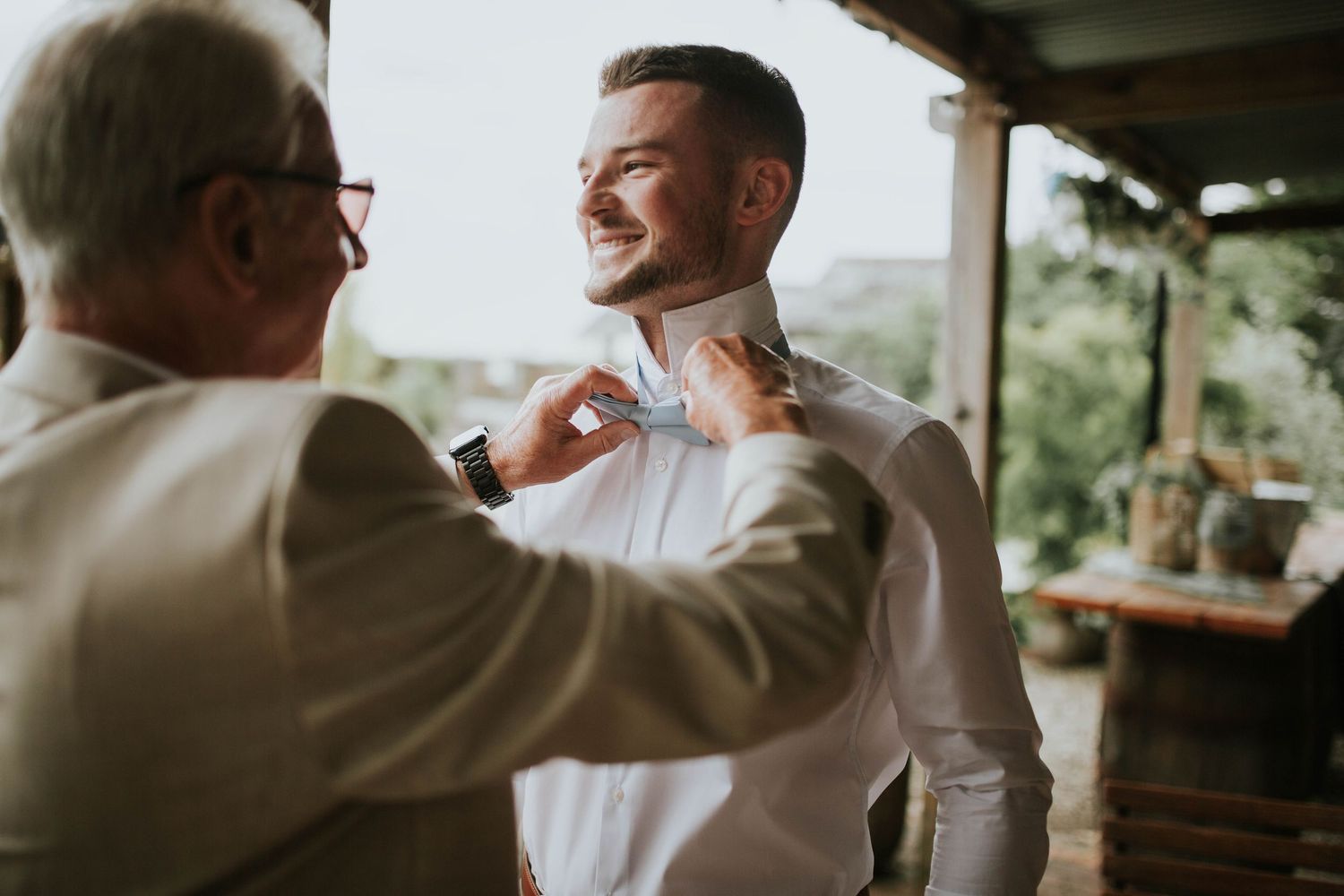 Photo of groom getting ready