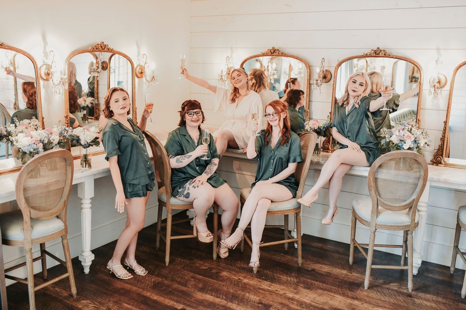 Bride getting ready with her bridesmaids at The French Farmhouse wedding venue