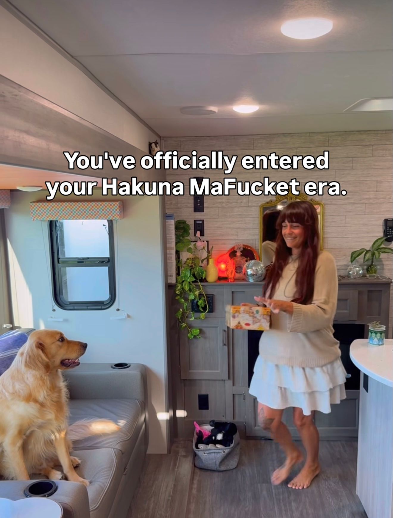 Spacious RV bedroom with a large bed, mirrored closet, and wood-paneled walls, captioned about giving kids the bedroom.