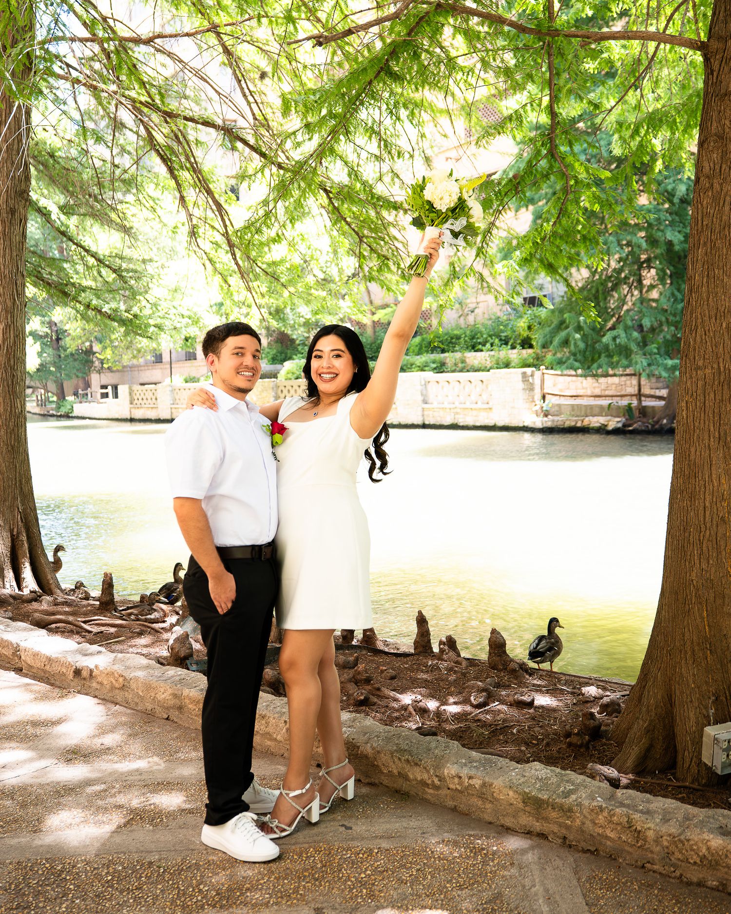 Portrait of newlywed couple celebrated at the infamous San Antonio Riverwalk.