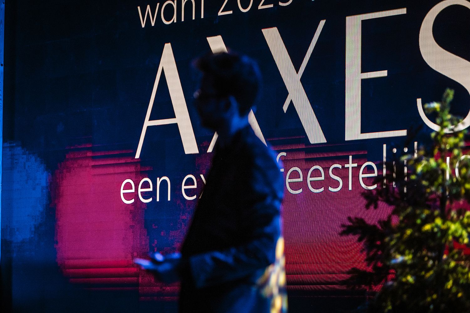 Creatief sfeerbeeld met eventbranding tijdens een zakelijk evenement van Axxes