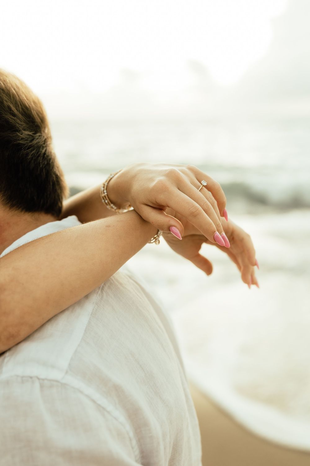 Playful sunrise beach engagement photos with golden light and bright blue waters. Jacksonville Engagement Photographer - Lindsay McDow Photo