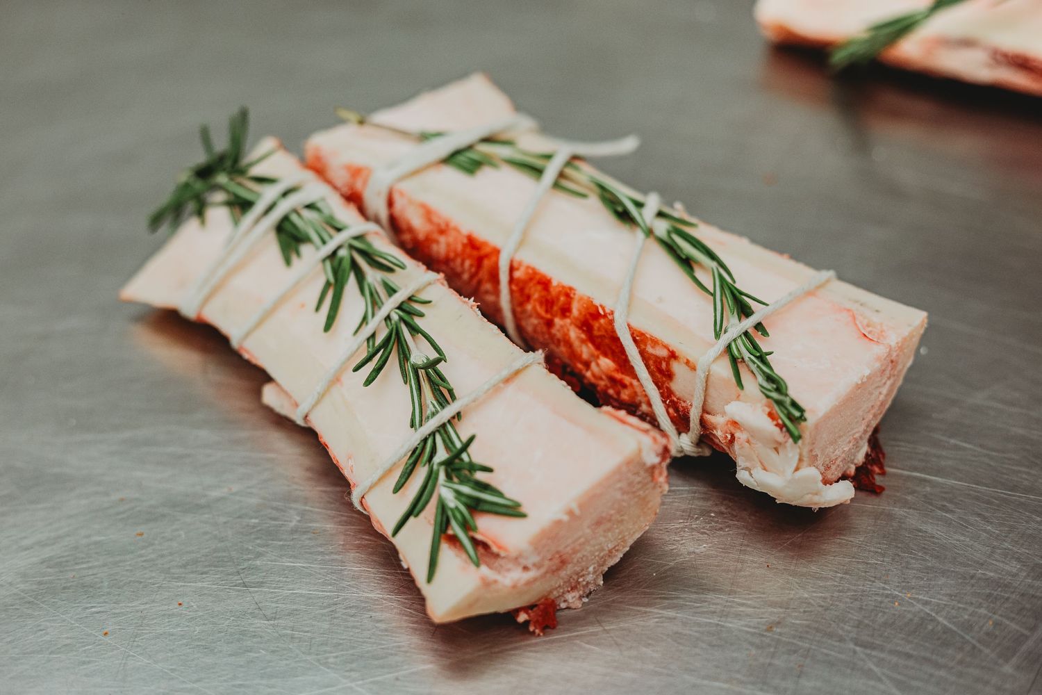 Bone marrow tied with rosemary.