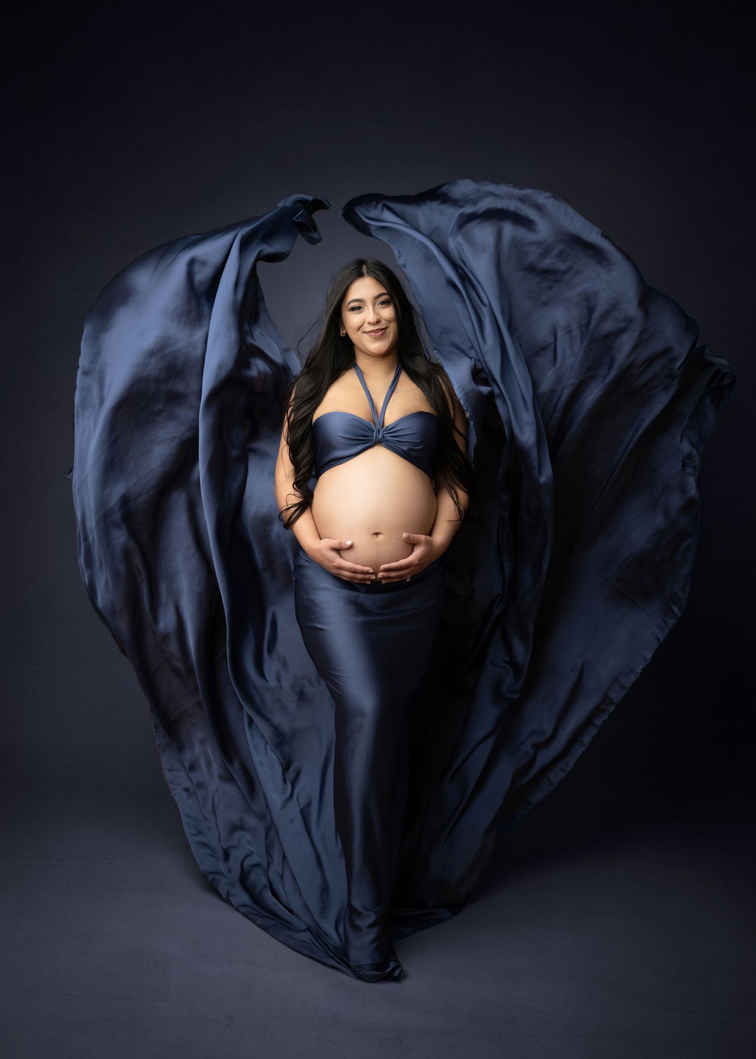 Blue Flowing fabric behind mother in studio session in Linden NJ