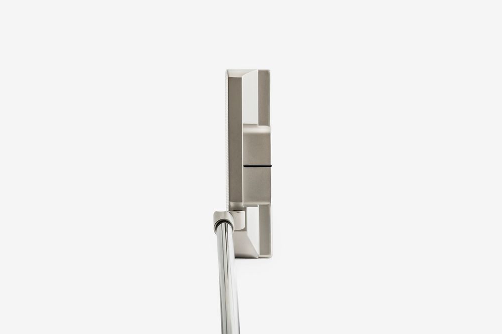 Silver blade-style golf putter with a square head and chrome shaft, shown in upright position on white background.