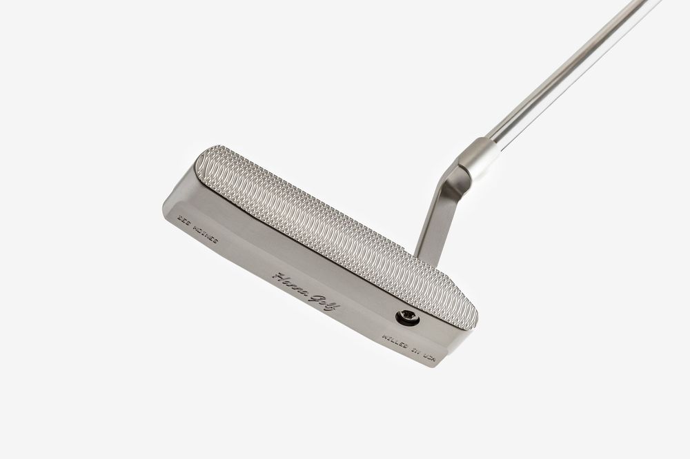 Sleek stainless steel blade putter with a milled face and slim hosel, ideal for precision putting on the green.