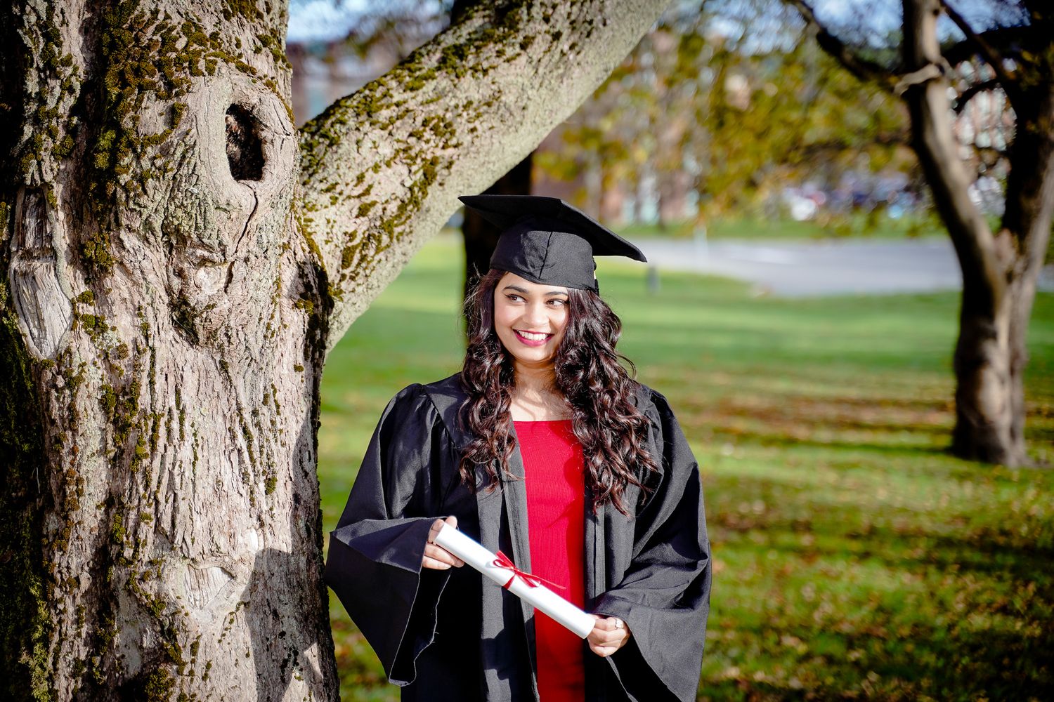"Sample graduation photo of a girl in a red dress at Memorial University of Newfoundland (MUN) during convocation
