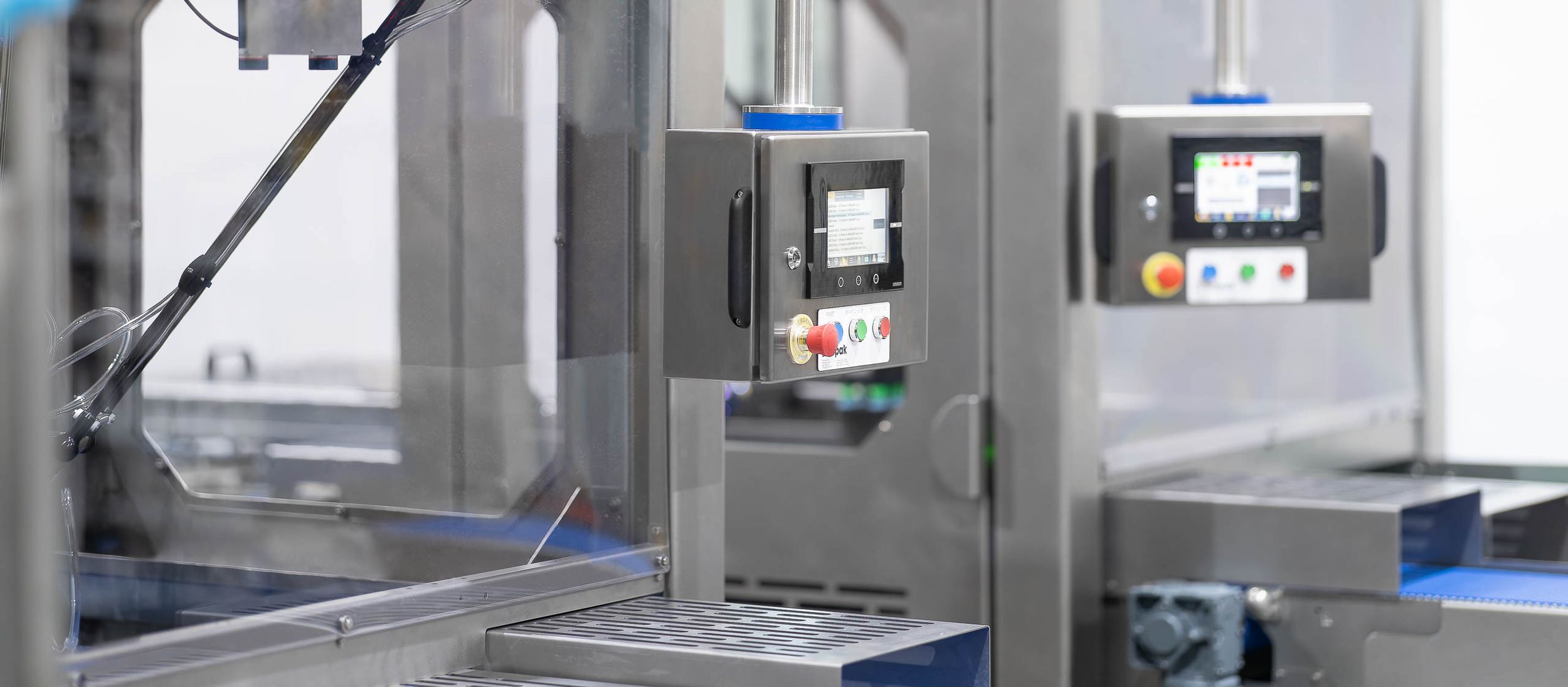 Machinery photographer Alan Harbord photographs a stainless steel industrial food processing machine in a modern manufacturing facility.