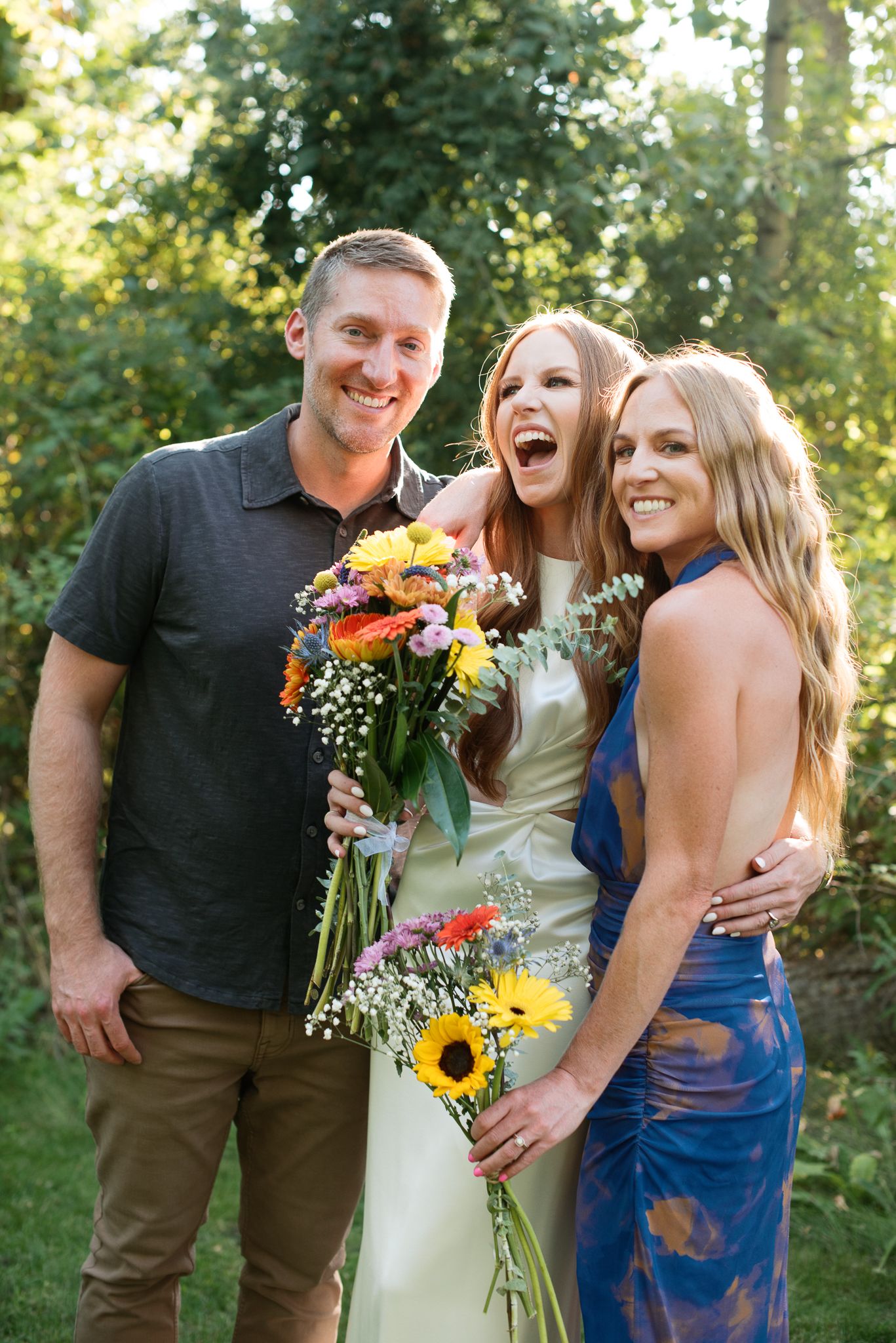 wedding photos of a bride with her brother and sister