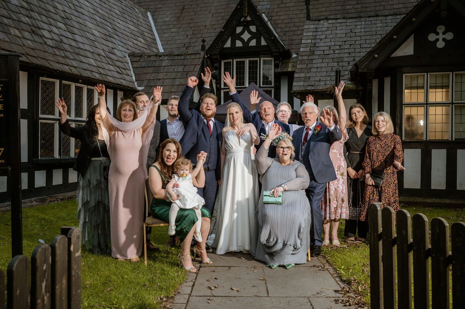 Wedding guests cheering outside Worsley Court House Salford