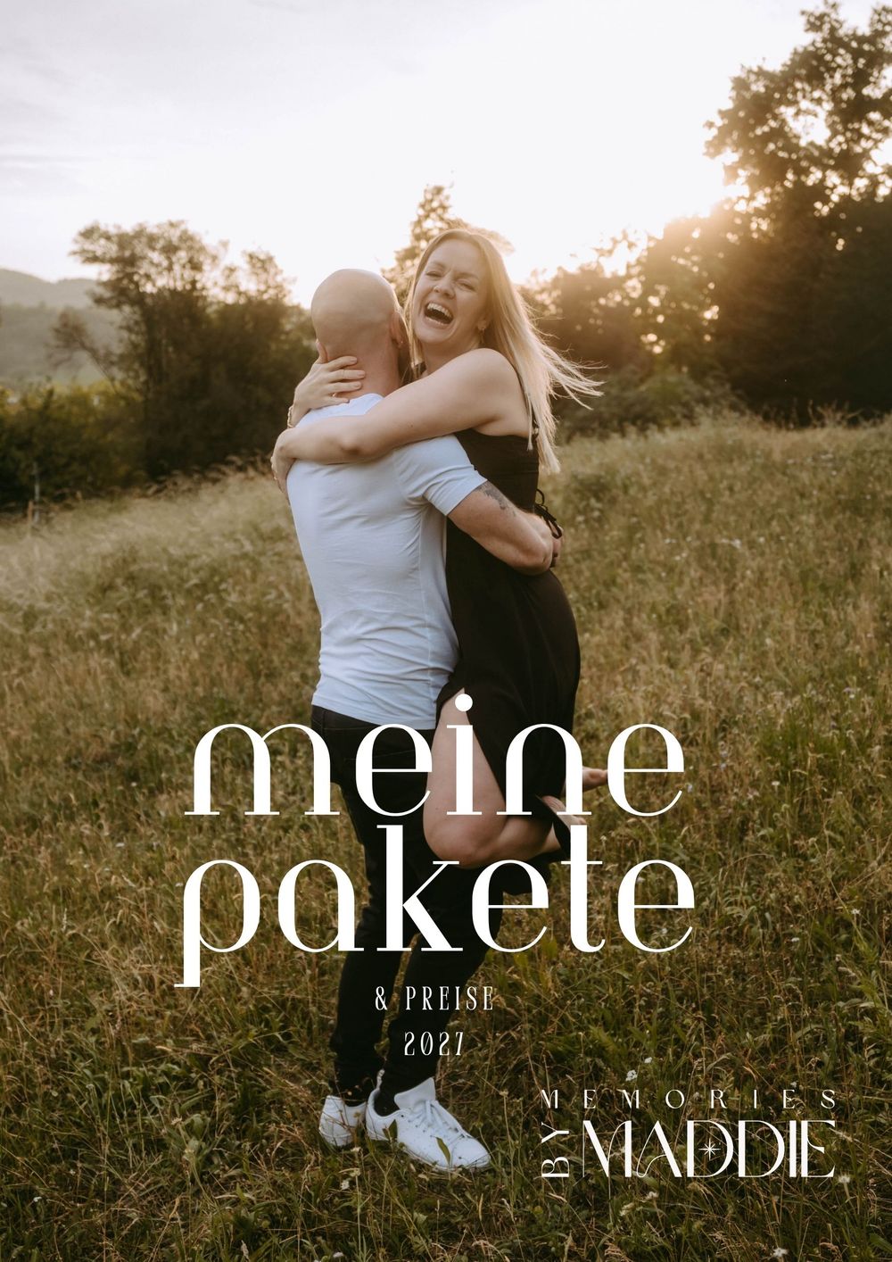 A joyful couple embraces in a sunlit meadow, featured on a German photography package pricing guide by Memories by Maddie.