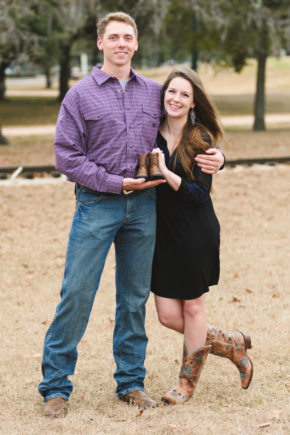 Couple together at Herman Park in Houston, warm natural moment.