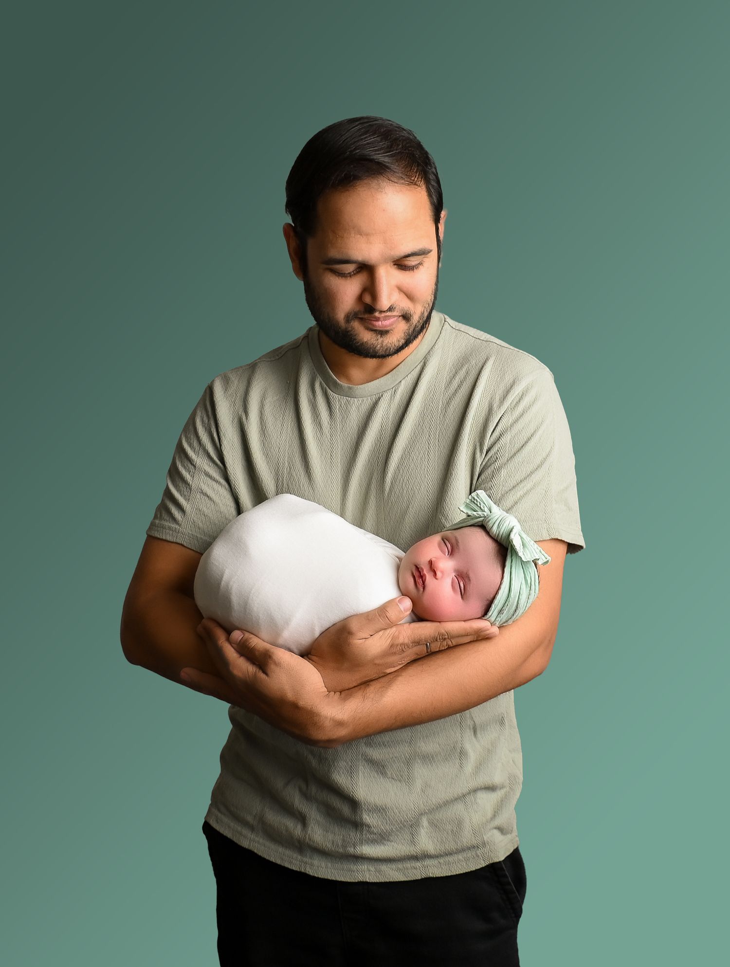 Dad holding newborn baby girl