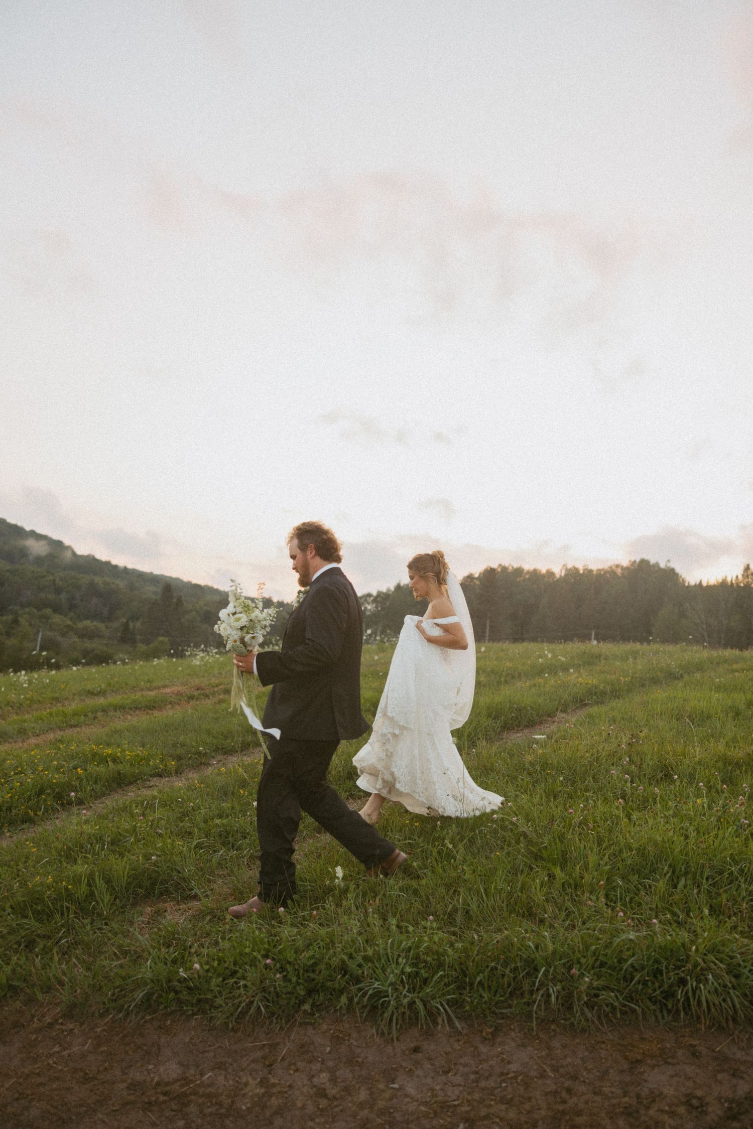 A wedding ceremony on a lakeside dock with decorative flowers.