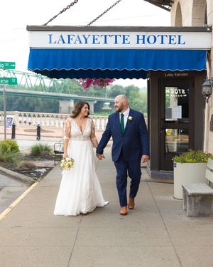 A sequence showing a couple walking outside the historic Lafayette Hotel.