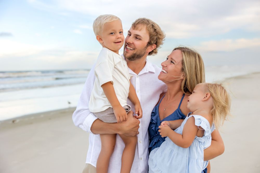 family photo session at the beach in st augustine florida on vacation with candids of kids laughing and playing