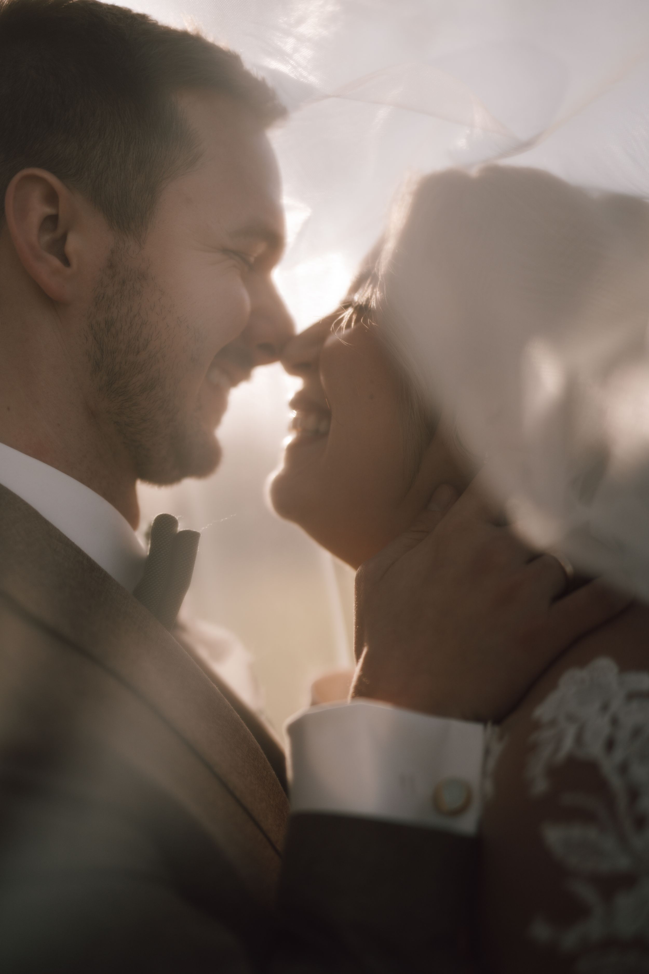 Intimate wedding couple portrait sequence in soft lighting and romantic atmosphere.
