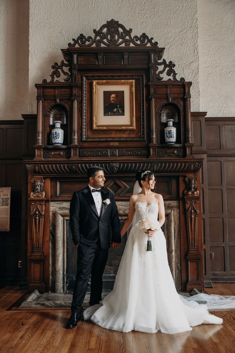 An elegant scene in a historic room with ornate wooden furniture and vintage decor.