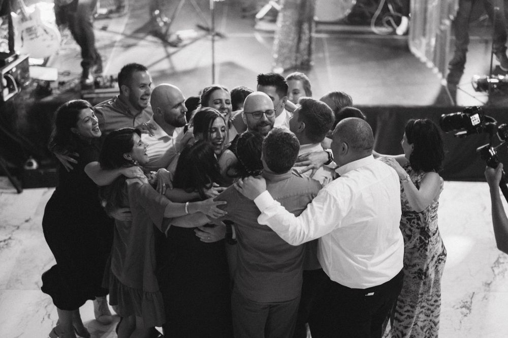 Black and white photograph of a crowded dance floor with people dancing.