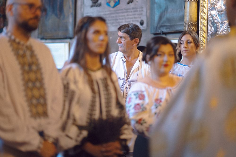 A group gathered wearing traditional embroidered clothing at a cultural celebration.