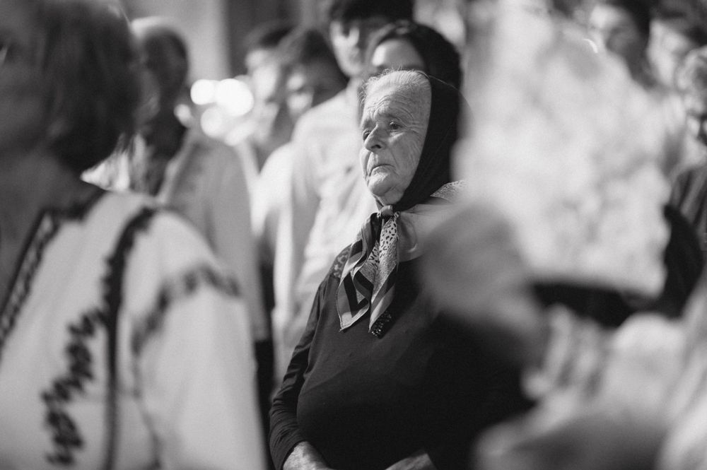 Candid black and white portrait of someone looking to the side.