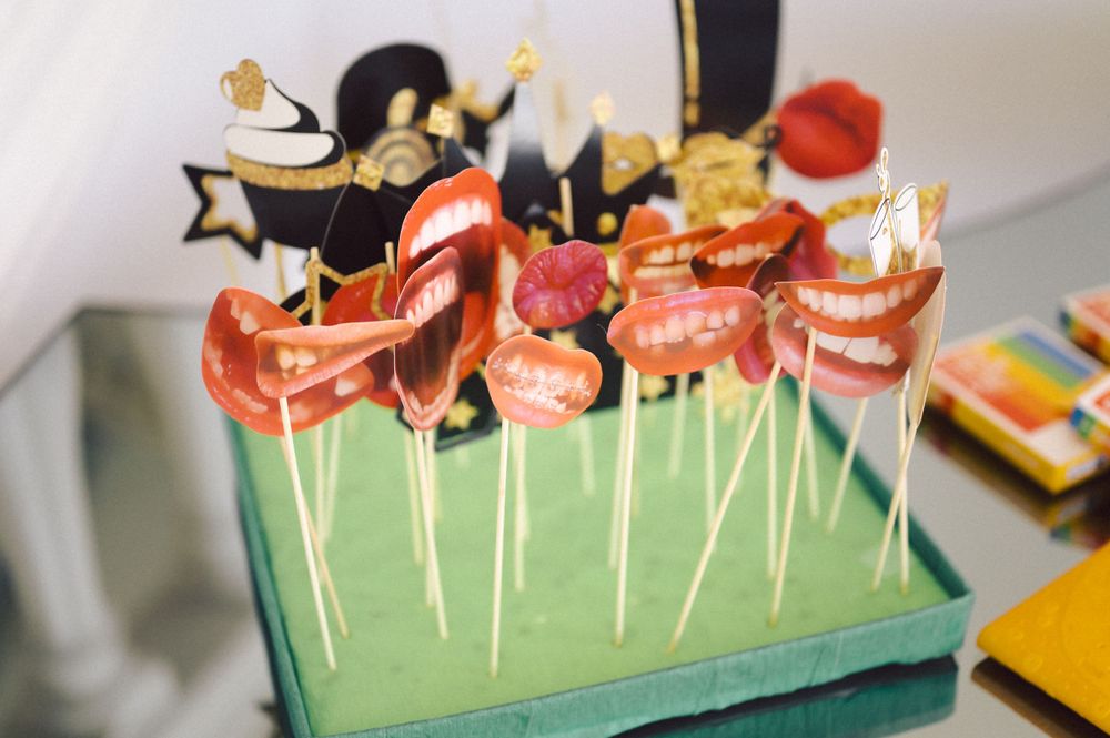 Whimsical dessert display featuring cake pops decorated with party-themed toppers.