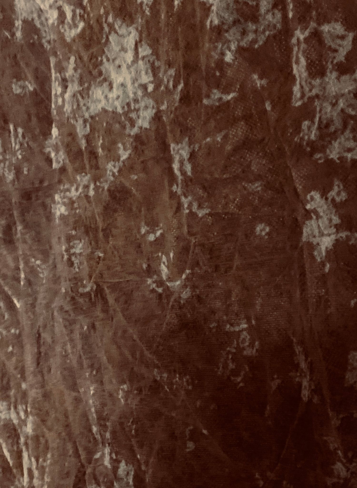 Dark brown marble texture with silver veining and mottled patterns, ideal for luxury backgrounds.