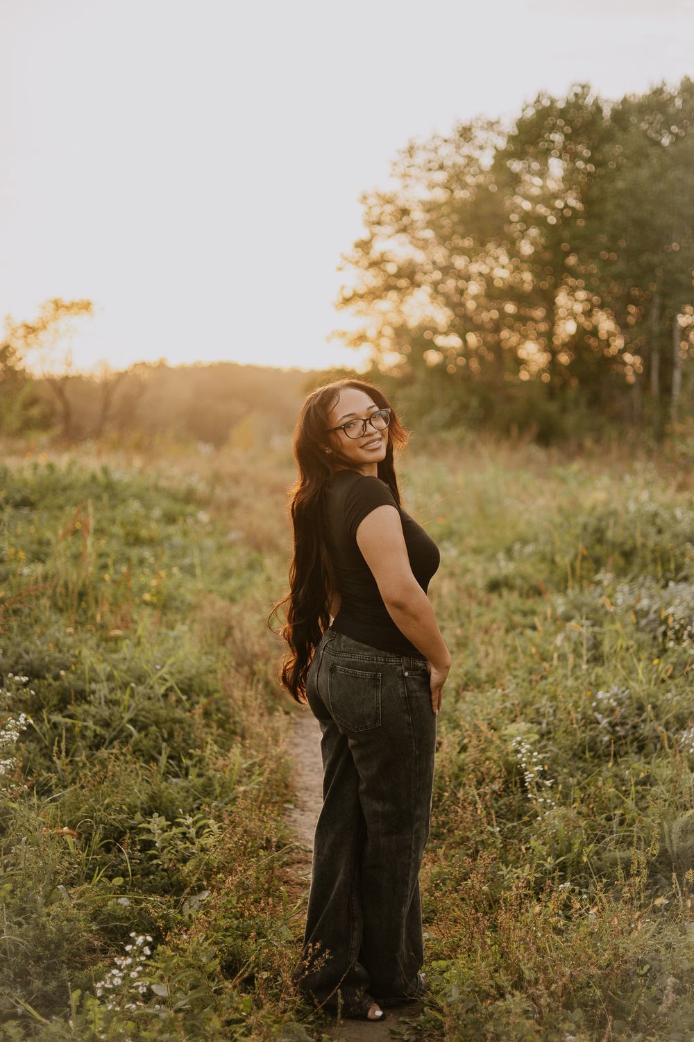 Candid moment captured in a wildflower field during golden hour.
