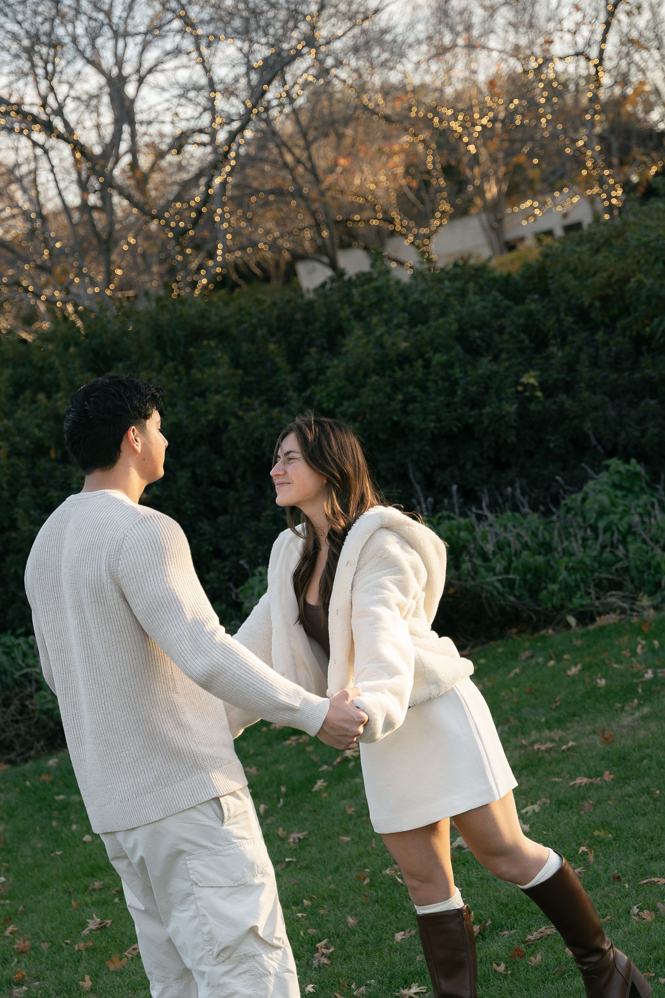 Luxury engagement proposal at Dallas Arboretum with couple smiling and hugging