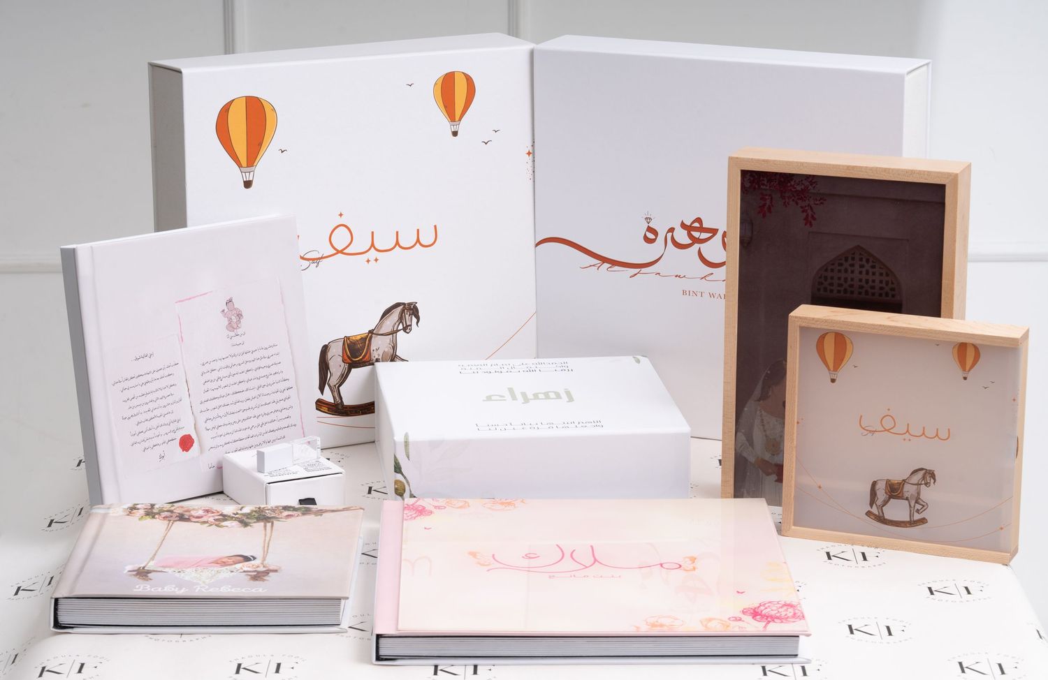 Collection of coordinated white stationery items featuring rocking horse and balloon designs.