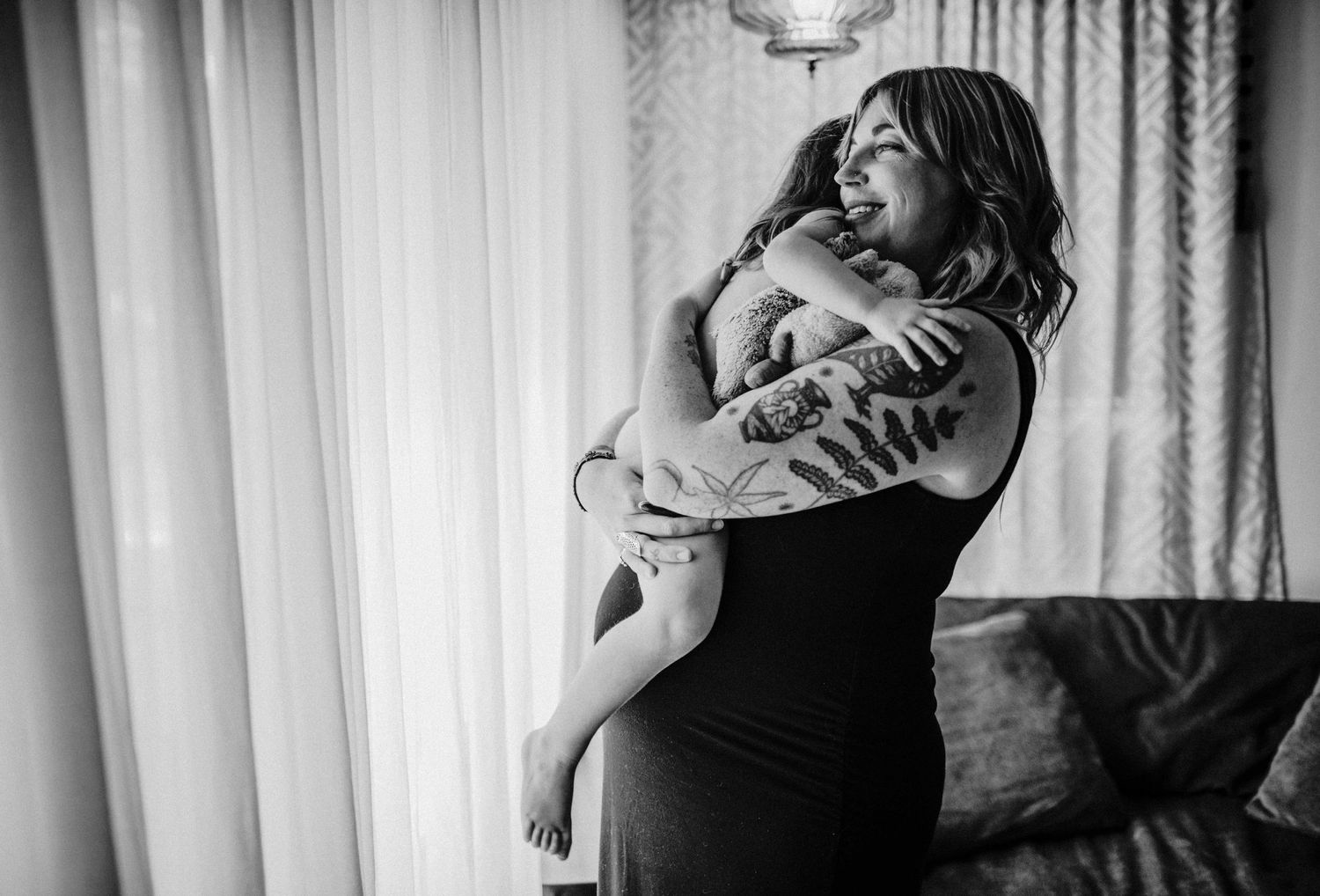 mother is hugging child tight portland oregon family photography rushes & Waves